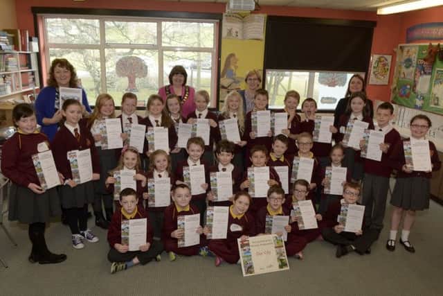 Edenderry Primary School pupils who took part in the Young Enterprise Primary Programme "Our City", included are Banbridge District Council Chairman Cllr Marie Hamilton, Ciara McIlmoyle (Young Enterprise), Volunteer Amanda Mulholland and Teacher Vera Lowry ©Edward Byrne Photography INBL1513-207EB