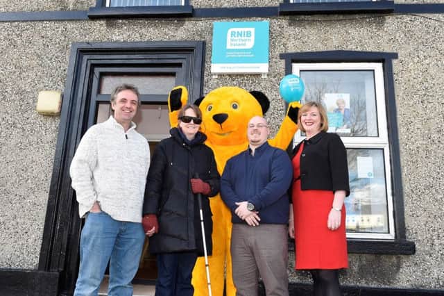Pictured at the Services Day are Coleraine residents Martin and Alison Purnell, Jonathan Adams (Community access worker RNIB NI), and Jillian Patchett (Senior Manager Prevention and Support Services RNIB NI) with RNIB mascot Sooty. Picture: Michael Cooper.