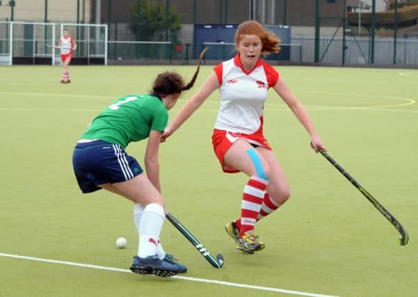 Larne Ladies and Cork Church of Ireland battle for the ball in the semi-final of the Irish Senior Trophy. INLT 13-242-AM