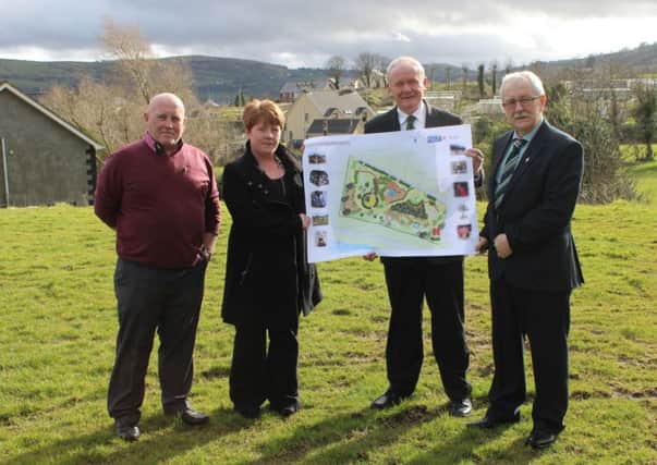 Mid and East Antrim Councillor James McKeown, Patricia O'Boyle of Croft Road Resident Group, Deputy First Minister Martin McGuinness, and East Antrim MLA Oliver McMullan pictured at the site where the new playpark will be constructed in Carnlough. INLT 13-683-CON