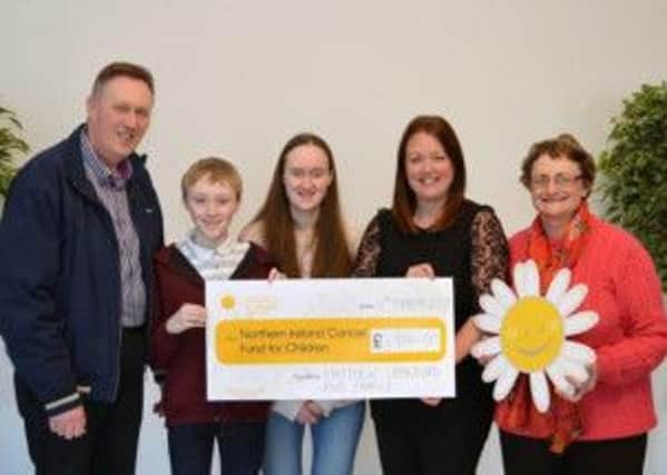 Clarence, Matthew, Hannah, Matthew and Rosemary Crawford with Cancer Fund for Children fundraiser Naomi Braithwaite (second from right) submitted picture