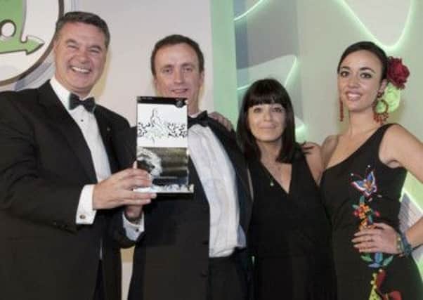John Mulholland (second from left), owner of award winning Co Antrim independent car dealer John Mulholland Motor Group pictured at the gala ceremony in Spain where the Randalstown based company was crowned  the UKs number one Skoda dealership.