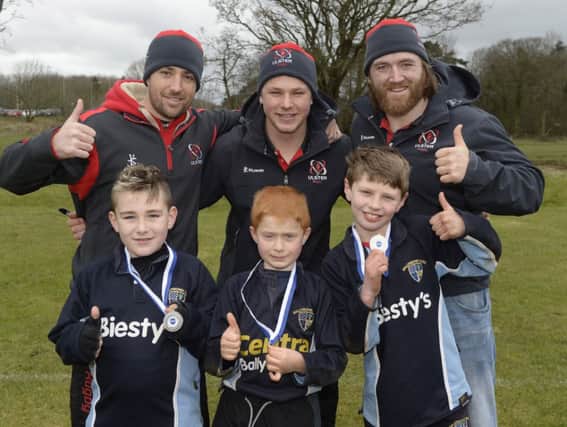 Brogan Bennett, Tyler Boyd  and Finn McCotter from Ballymoney pictured with Ulster players,Ian Humphreys,Dave Ryan and Luke Marshall


ULSTER RUGBY STARS MAKE GUEST APPEARANCE
Ulster Players In Town For Mini Rugby Festival

Ballymena Rugby Club celebrated their annual mini rugby festival on Saturday with Ulster players  Ian Humphreys, Luke Marshall and David Ryan  .
 Over 1,000 mini rugby players from 12 different clubs came to Eaton Park to participate in one of the biggest annual mini rugby festivals in Northern Ireland.  Carrickfergus, Bangor and Malone were amongst the clubs in attendance which saw the under 6s kick off the day with tag rugby in the morning.
Ulster Rugby  star Luke Marshall who returned to this  old club to watch the junior teams in action introduced David Ryan to the ground where he grew up. Padraig O'Rourke, a representative from event sponsors Hughes Insurance commented:  "Hughes Insurance is delighted to sponsor this fantastic family fun day, it's a great event for the local community