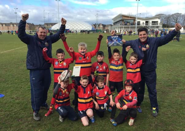 Some of the coaches and players at Ballyclare Mini Rugby celebrate their big Newtownabbey Sports Awards win. INLT 14-947-CON