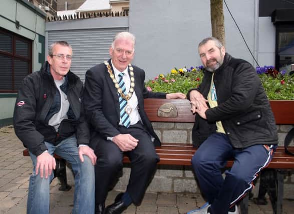 The Mayor of Ballymoney, Alderman Bill Kennedy, has a look at the new seats along with locals Seamus Kelly and Stephen Hargin.