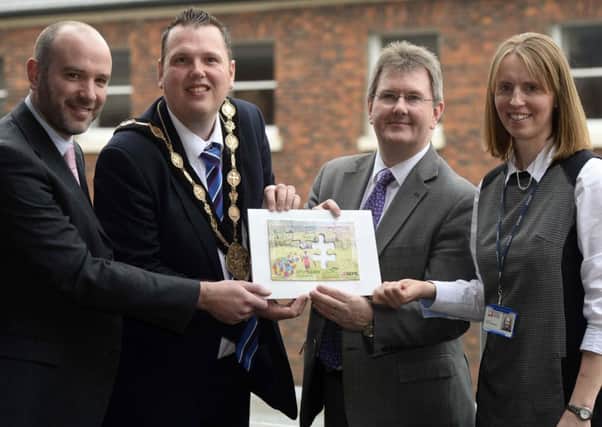 At the launch of the Upskilling Uganda project are Fields of Life Chief Executive Richard Spratt, Lisburn Mayor Councillor Andrew Ewing, Jeffrey Donaldson MP and SERC Head of Development Claire Henderson.