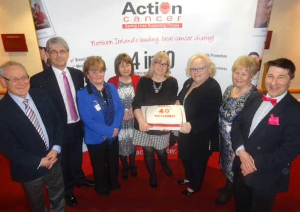 Whiteabbey Action Cancer Group celebrates 40 years with Action Cancer Chief Executive Gareth Kirk and Action Cancer Chairman Norman Carson. INNT-13-724-con