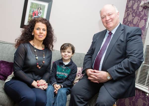 David Simpson MP with Karen Lewis and her son, Oliver (9), who suffered from Meningitis 8 years ago and had to have a bilateral knee amputation, as a result.