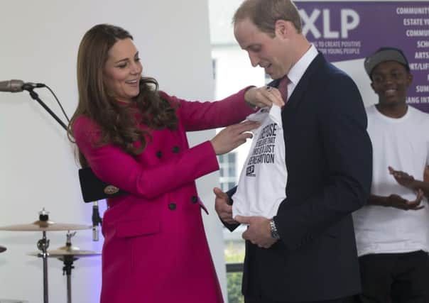 The Duke and Duchess of Cambridge are presented with a baby grow for their second child