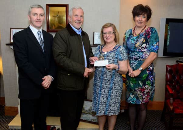 Damian Cassidy and Alan Campbell from Killcreggan Urban Farm receiving a legacy cheque from outoing Deputy Mayor Lynn McClurg and Chief Executive Sheila McClelland.  INCT 13-054-GR