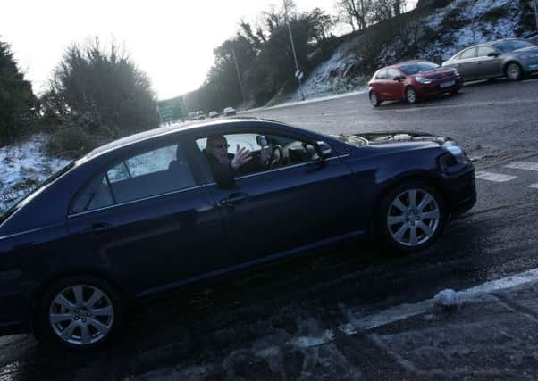 Daly's Brae resident Peter McCafferty struggles to get out onto the main Glenshane Road earlier this year.