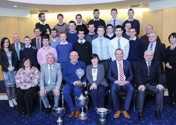 Players and officials from Robert Emmets GAC Slaughneil, pictured with Magherafelt Council chairperson Kate McEldowney, Cathal Mallaghan, chair of the Mid Ulster Council and councillors at  a Civic Reception at Magherafelt Council offices.INMM1415-317