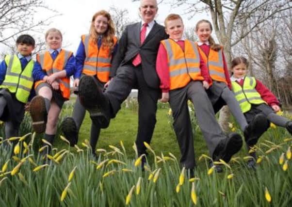 Transport Minister Danny Kennedy joins Rachel Williams, Hannah Ellish, Madison Henry, Arron Waddell, Jennifer Marrow and Emily Johnston from Poyntzpass Primary School and St Joseph and St James Primary School in Armagh to launch the Travelwise NI Walk to School Week competition