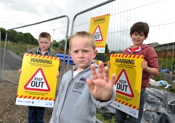 L-R John , Preston  and Ethan warn the public to stay away from dangerous sites. (suibmitted) Picture: Michael Cooper