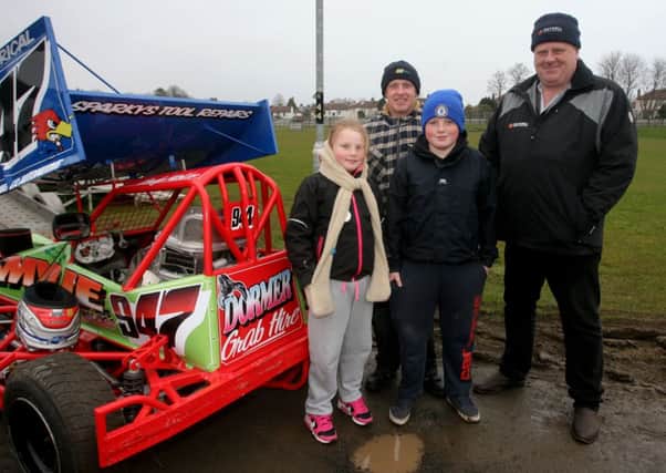 Raymond Percy and his children Lauren and Stuart, along with Gary Maxell looking around the pits at Ballymena Raceway. INBT15-212AC