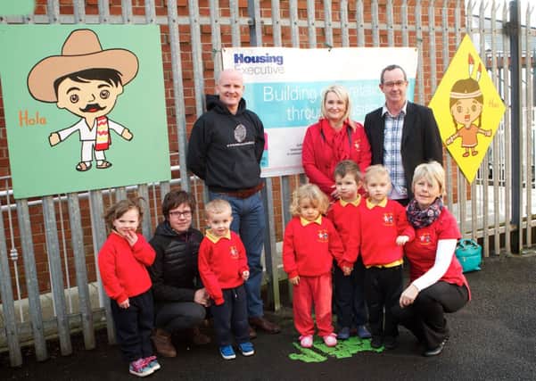 Pictured at the launch of the new art work at the Tiny Tots Community Pre-School are Eddie Breslin, Housing Executive Good Relations officer, Elaine Donaghy, project manager and artist Sean O'Donnell with Eva, Claudia O'Neill, from the Housing Executive, Joseph, Yagoda, Oliver, Amelia, and Geraldine McGuinness, playgroup leader.