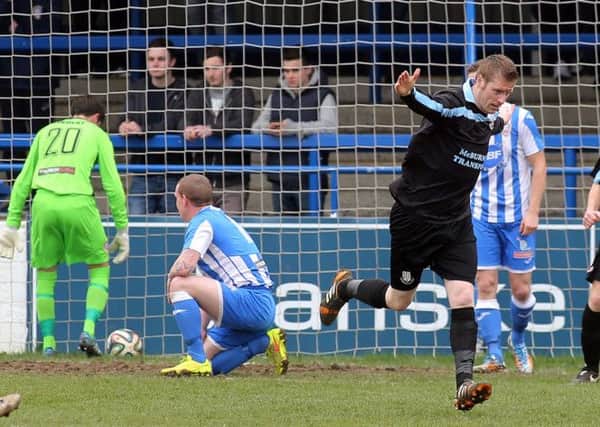 Darren Boyce wheels away in celebration after his second minute header ends up in the Coleraine net during today's game at Ballycastle Road. Picture: Press Eye.