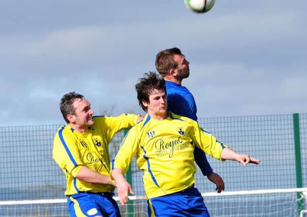 Killymoon Rangers and Brantwood battle for the ball in the air during Saturday's league clash at MUSA.INMM1215-344