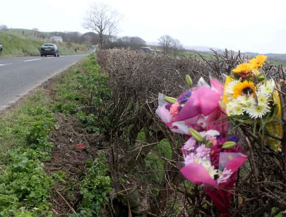 Flowers are laid at the scene where Johnny Black and Robin Wilson died in a car smash on the Cushendall Road, Ballycastle in the early hours of Monday April  2015. Picture Kevin McAuley/McAuley Multimedia