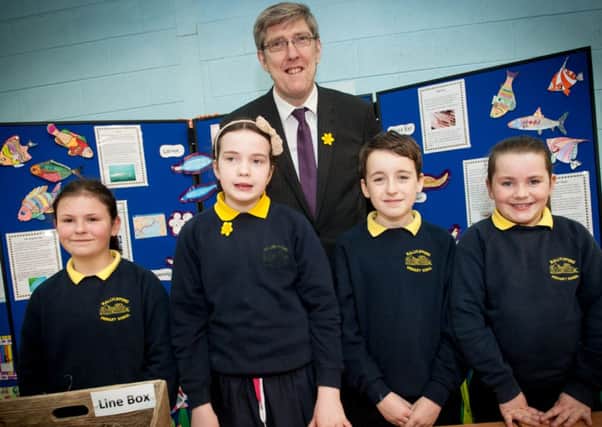 The Minister for Education, John O'Dowd pictured with children from Ballylifford Primary School at the St Pius X College's annual Environmental Competition.