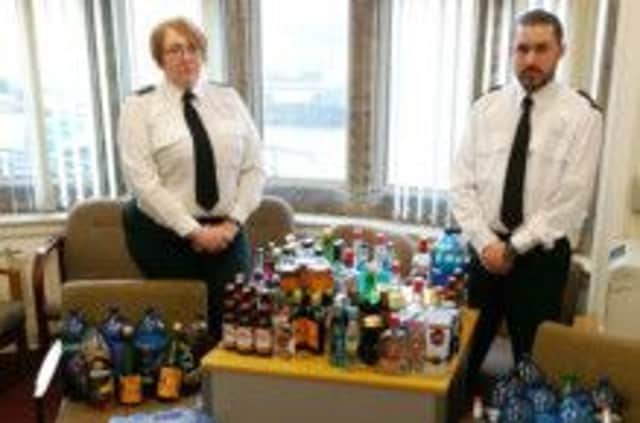 Haul: Constables Burns and Coyle with seized booze