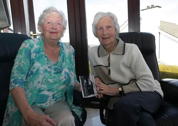 HIlary McClean pictured at her Clearwater home this week with her sister ????????????????. She is holding a picture of her late uncle and poet, George Paxton. INLS1415MC010

OLGA - CAN YOU GET THE NAME OF HER SISTER (ON RIGHT) AS I LOST MY NOTES!!!! JIM