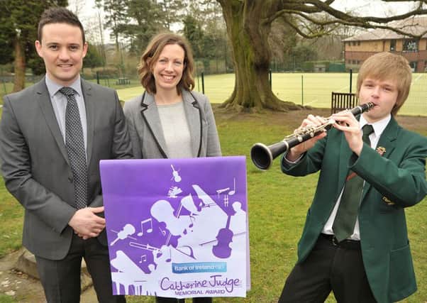 Robert Harrison is pictured with Bank of Ireland UKs Lisburn Business Advisor Patrick Rooney and Friends Head of Music Niamh Blakeman.
