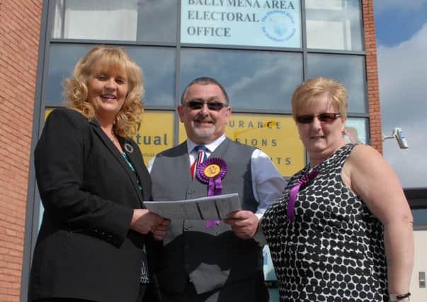 UKIP North-Antrim candidate Robert Hill  and his electoral agent Sharon Boyle hands his nomination papers to Rea Kirk, Deputy Returning Officer at the Ballymena Area Electoral Office. INBT 16-102JC