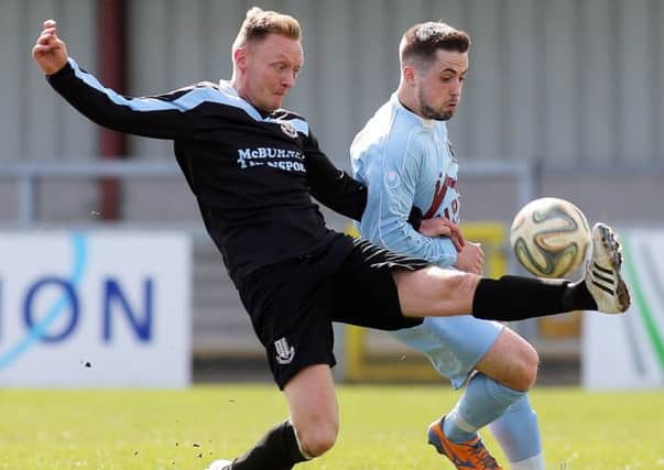 Ballymena United defender Stephen McBride clears the danger ahead of Institute's Robbie Hume during today's Danske Bank Premiership match at Drumahoe. Picture: Press Eye.