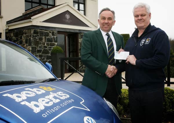 Keith Dinsmore, captain of Galgorm Castle Golf Club, receives sponsorship from Graham Sparks of Bob & Berts. INBT15-209AC