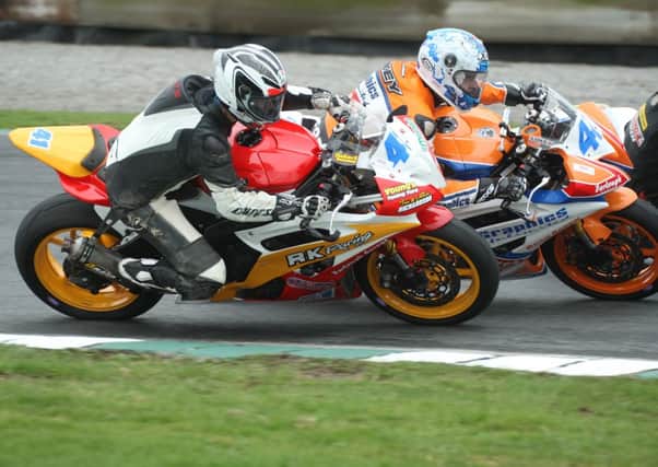Dundrods Robert Kennedy dives under Ahoghill rider Luke Johnston in the Supersport 600 race. Picture: Roy Adams.