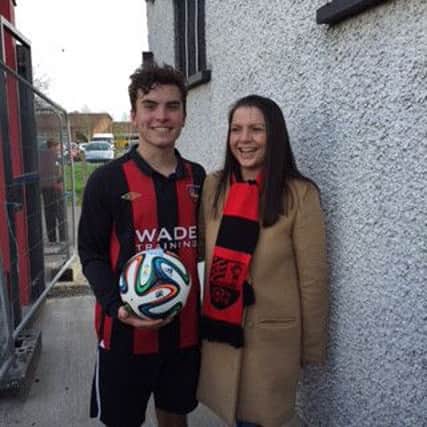 David Gray is congratulated by his proud mother Grace after netting a hat-trick on Saturday. David's parents Grace and Irwin are regulars at Town's matches to support their son and his team-mates.