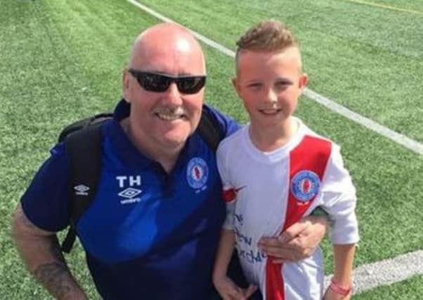 Banbridge Rangers' first European goal scorer Thomas Hawthorne Junior with coach and proud dad Thomas after smashing the club's first goal in Salou.
