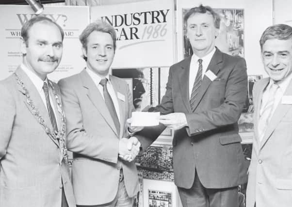 Councillor John Tierney, vice-chairman of the Foyle Development Organisation, presenting a cheque for £10,000 to Mr Peter Gallagher, Chairman of the Noribic Business Innovation Centre, at the official opening in 1986. Tributes have been paid to the late Mr Gallagher, who died at the weekend.
Also pictured (on left) tis the Mayor of Londonderry, Noel McKenna, and (on right) is TJ Mulcahy, Committee of the European Commission, Brussels.(0107MM02)