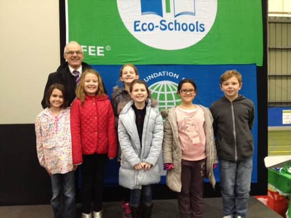 Eco-Schools ambassador Frank Mitchell with Oakfield Primary School pupils at the 20th anniversary celebration. INCT 15-704-CON ECO