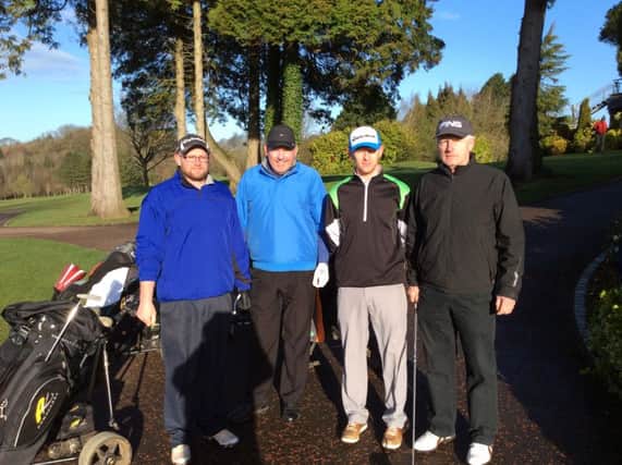 heading out at Dunmurry Golf Club on Saturday were from left - Felix Kieran who recorded a hole in hole at the third hole with playing partners Iain Ferguson and Canice Ward.