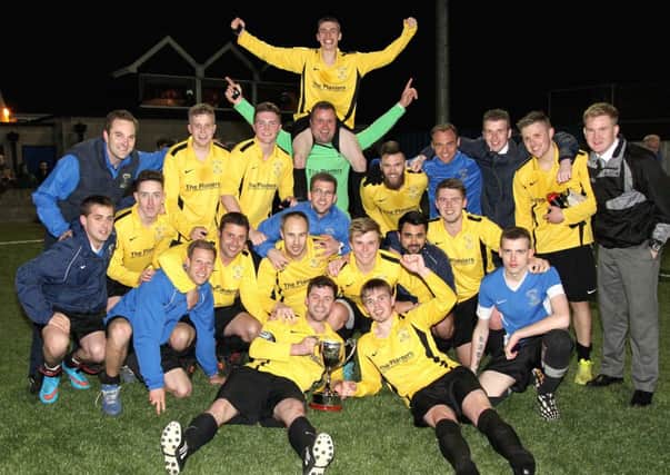 Dollingstown Reserves celebrate after winning the Wilmor Johnston Memorial Cup, beating Armagh City Reserves 5 - 4 on penalties