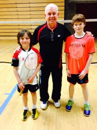 Jack Armstrong (right) defeated Stuart McCollam (right) in the final of the Under 13 Boys Singles in the Alpha Easter Tournament.  In centre is Trevor Woods (Alpha Badminton Club).