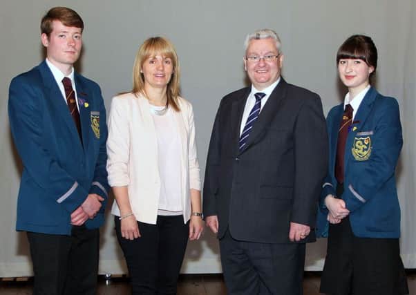 Slemish College Head of 6th year Mrs. D. Mitchell and Dr. P. McHugh, principal; joined by Head Boy Connor Lunnun and Head Girl Abigail Fletcher. INBT 17-804H