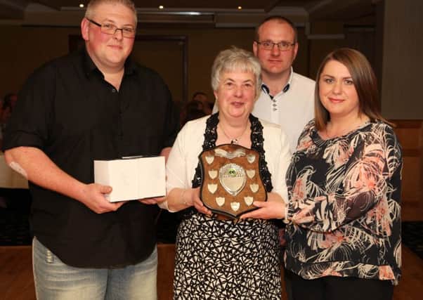 Philip Stirling and May McAuley (Dunluce Pres.) are presented with the pairs winners award from Ruth McCurdy (president's wife) and Alan McCurdy (league president) during the Bushmills and District League prizegiving dinner held at the Royal Court Hotel. INCR17-309PL