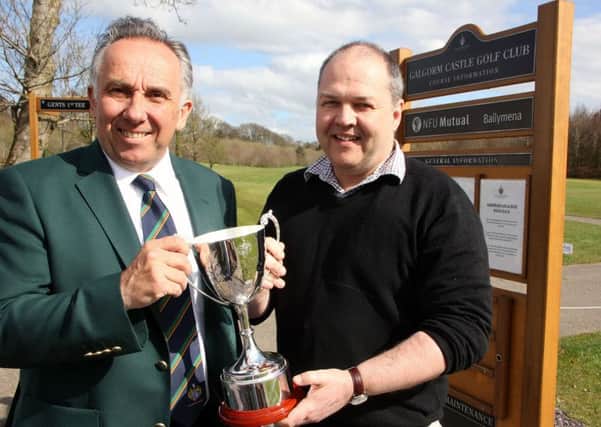 Alistair Gibson presents the Bertie Gibson Memorial Cup on behalf of his late father, to Galgorm Castle Golf Club captain Keith Dinsmore. The annual competition in memory of Bertie, the first Captain and President of the Galgorm club, will take place this year on May 2. INBT 17-811H