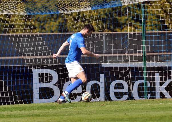 Eoin Bradley walks the ball into the net.