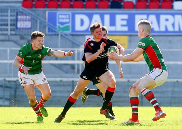 Larne's Jordan Burns (right) and Limavady's Peter Wilson in action during the Gordon West Cup final. Picture: Kevin Scott / Presseye