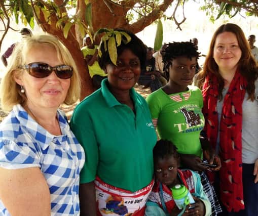 Ballymena and Antrim Times reporter Lorna McKay (right), pictured with Concerns Rose Caldwell and Agnita Munyama and her two daughters.  Agnita is  a community health volunter for Concerns RAIN project in the Mumbwa district, advising other local women on cooking nutritious food.