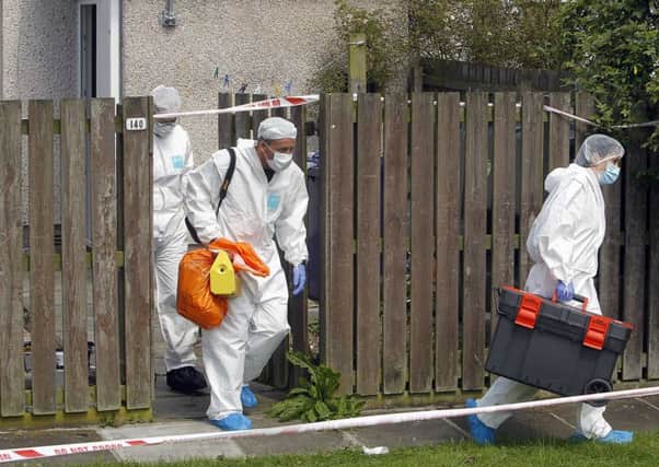 Craigavon 
Police Forensics leaving the murder scene of 40 year old Owen Creaney of Victoria Place Lurgan