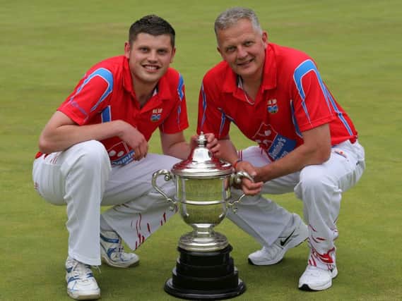 Jordan Dallas and his dad Victor pictured after Coleraine's win over Ballymoney in the final of the IBA Senior Cup at Belmont Bowling Club in 2013, it was the club's first success at this level since 1921. Mandatory credit - John McIlwaine/Press Eye