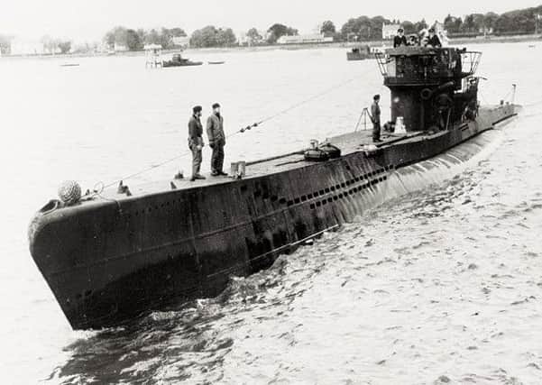 One of the u-boats surfacing on the River Foyle during the surrender.