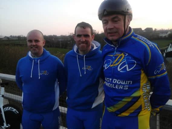 Two new members of the West Down Wheelers Jonathan Maxwell and David Frizell getting expert advice from John Clyde.