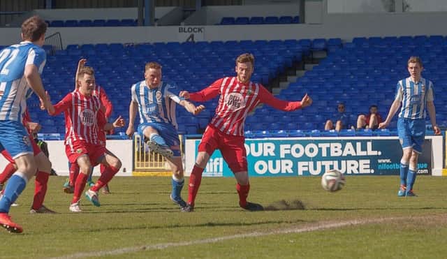 Ian Parkhill watches his second of the afternoon on its way to goal  photo:Derek Simpson