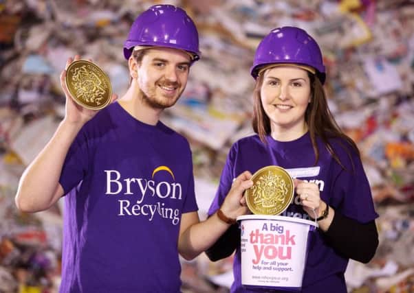 Declan Reynolds, from Bryson Recycling, and Eva Toil, from the NI Hospice, announce the fundraising total of £6482 from the annual '£1 a tonne campaign, which will go towards the hospice rebuild. INNT 16-458-CON